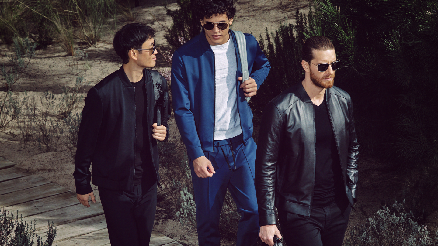 Shows Picture of man-with-sunglasses-walking-boardwalk.png