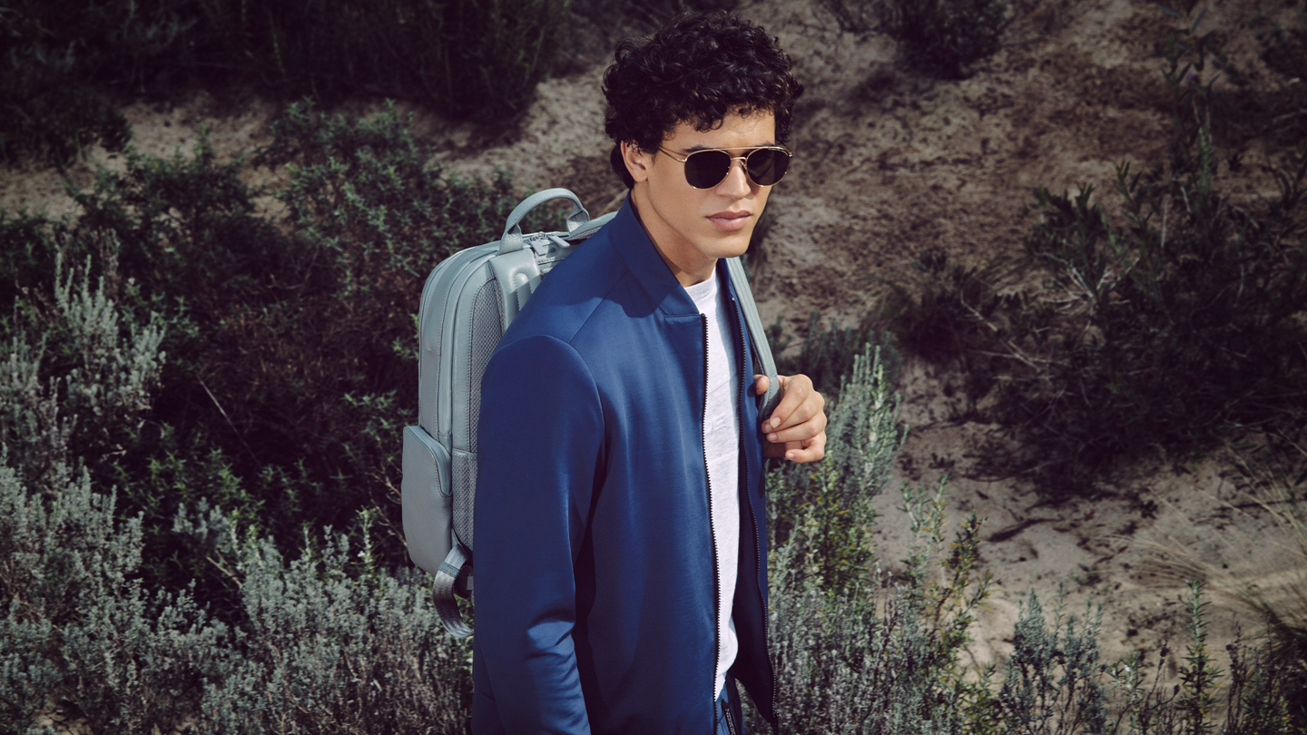 Shows Picture of man-with-leather-backpack-and-blue-jacket.png