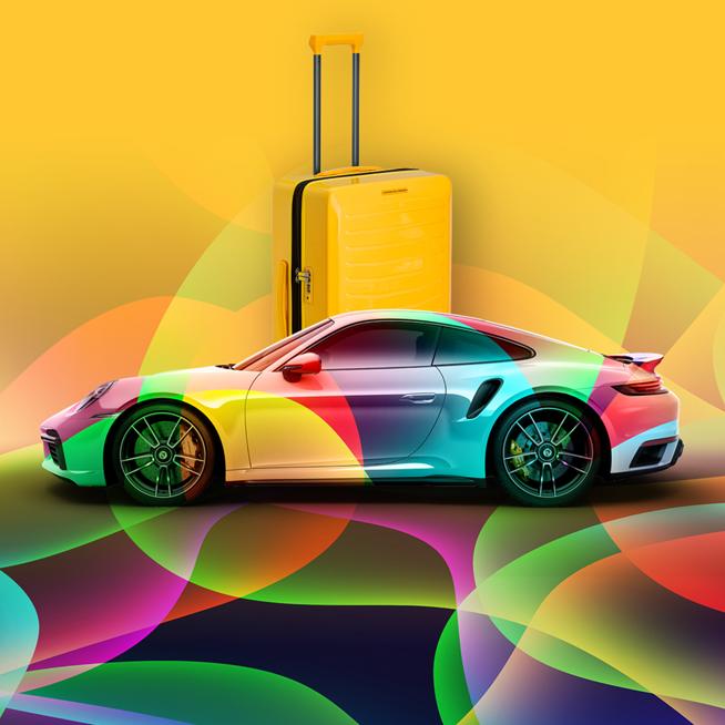 Shows Picture of yellow-hardcase-trolley-behind-porsche-turbo-colourful.png