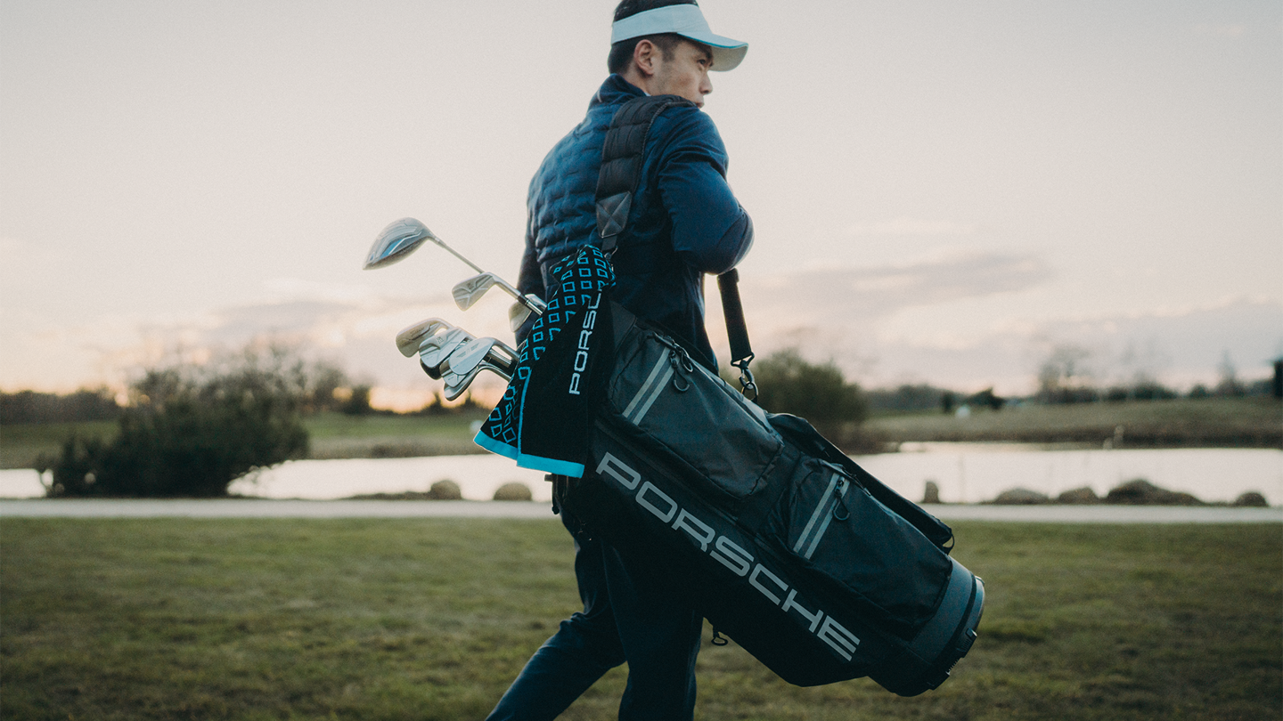 Shows Picture of man-carrying-golf-bag-on-the-beast.png