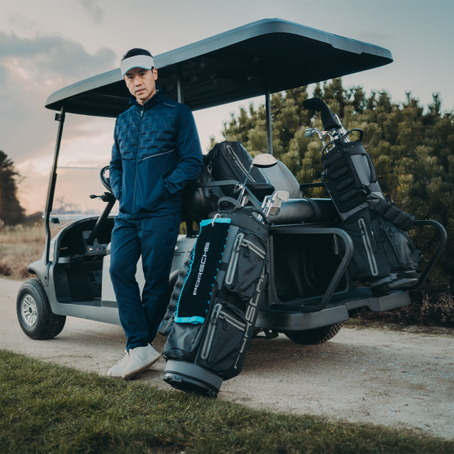 Shows Picture of man-infront-golf-cart-full-equipped-golfbag.png